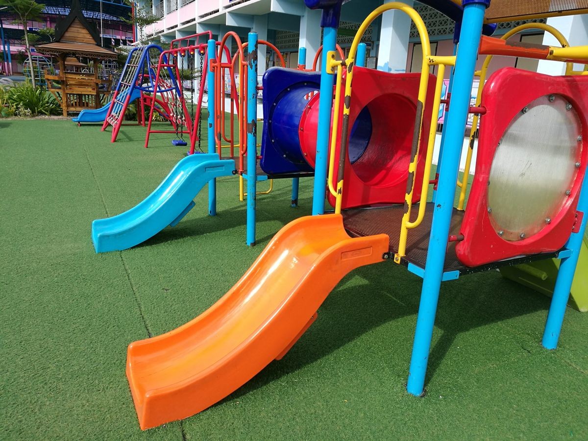 The playground is full of colorful toys to delight all children.Set on artificial turf to be safe for children.