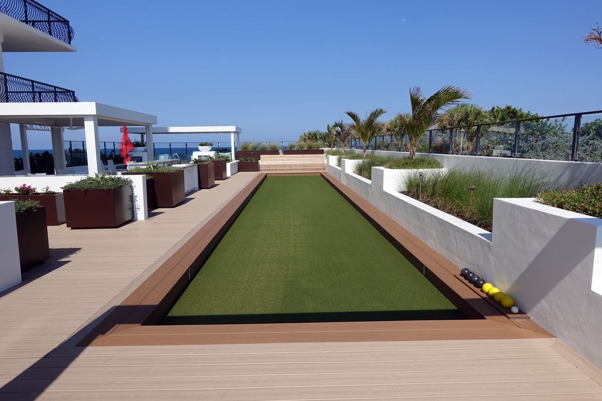 Beautiful artificial turf bocce ball court on a rooftop terrace.